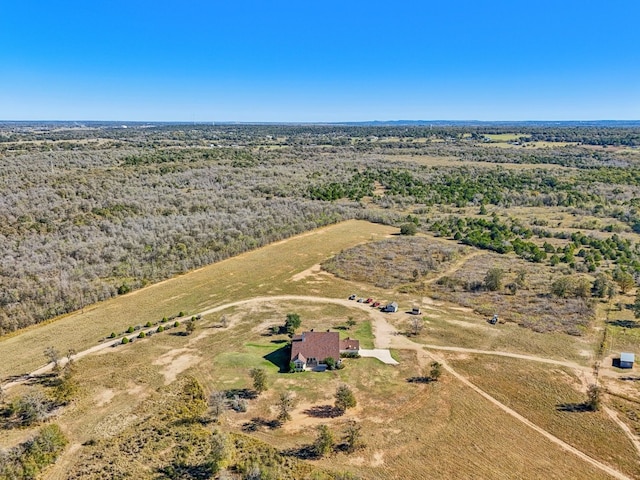 birds eye view of property with a rural view