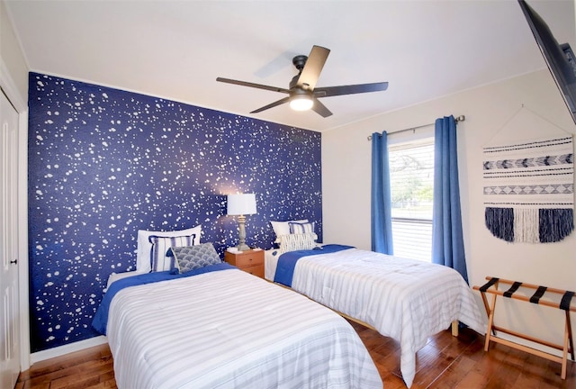 bedroom with wood-type flooring and ceiling fan