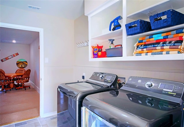 washroom featuring washing machine and clothes dryer