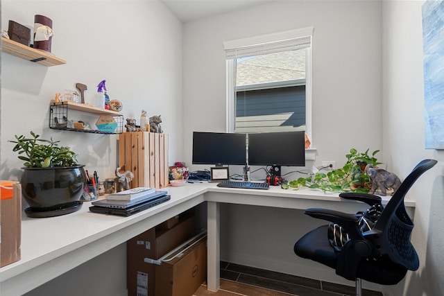 office space featuring built in desk and wood finish floors