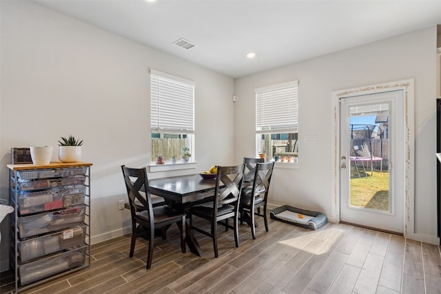 dining room with dark hardwood / wood-style floors