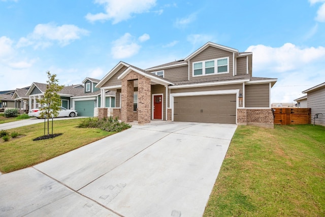 craftsman-style home featuring a front yard and a garage