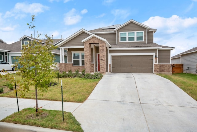 craftsman inspired home featuring solar panels, a garage, and a front lawn