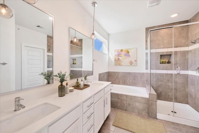 bathroom with vanity, independent shower and bath, and tile patterned flooring