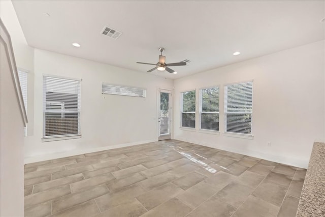 unfurnished room featuring ceiling fan