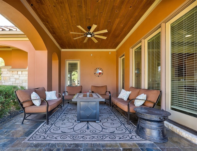 view of patio featuring an outdoor living space with a fire pit and ceiling fan