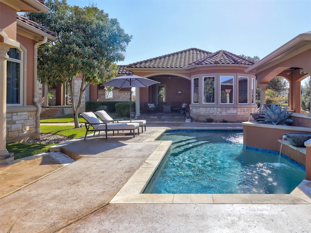 view of swimming pool featuring a patio and pool water feature