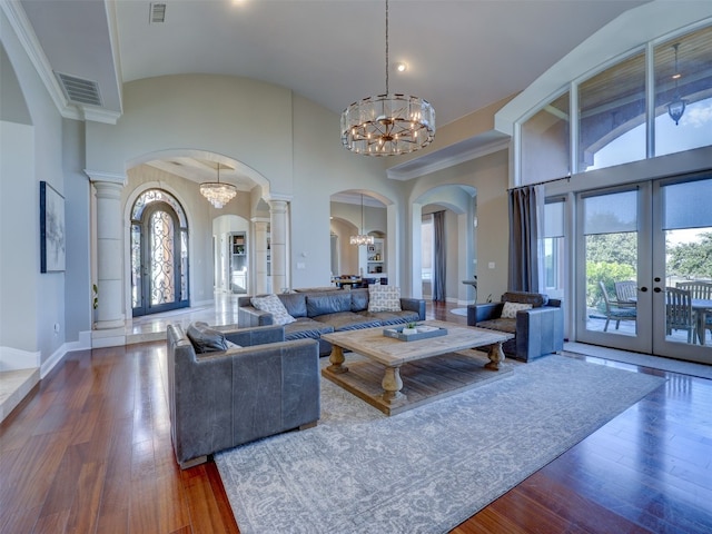 living room featuring french doors, plenty of natural light, and hardwood / wood-style floors