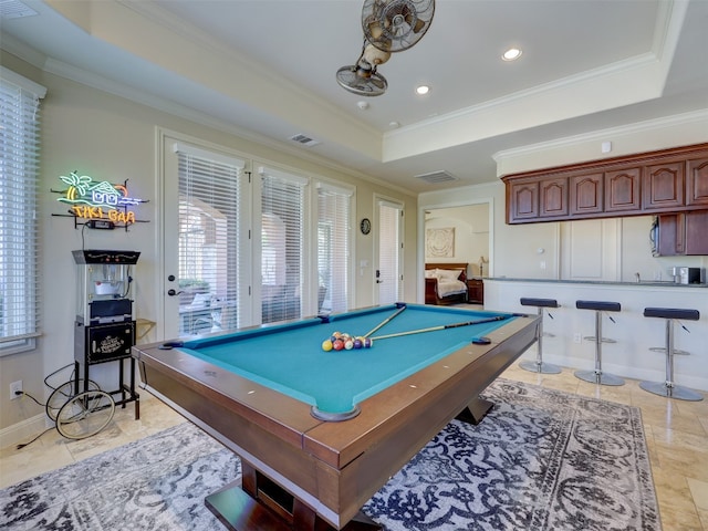 game room featuring a raised ceiling, crown molding, and pool table