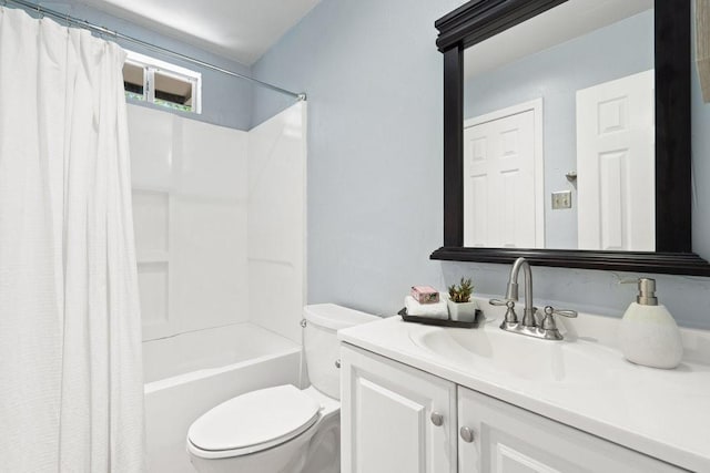 full bathroom featuring shower / bath combo, vanity, and toilet