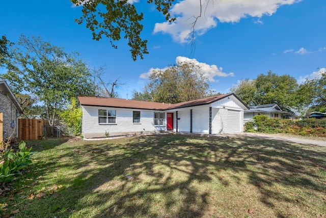 single story home with a garage and a front lawn