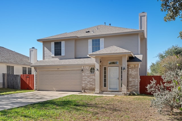 view of front of home featuring a front lawn and a garage