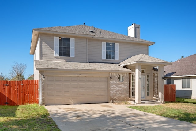 front facade with a front yard and a garage