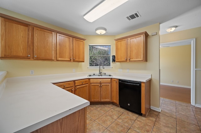 kitchen with dishwasher, light tile patterned flooring, and sink