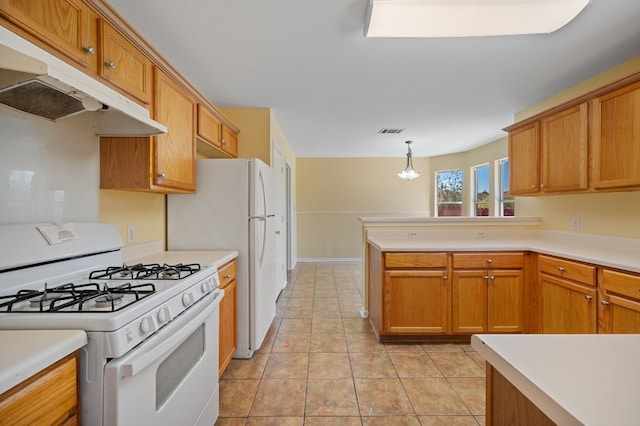 kitchen featuring pendant lighting, white appliances, an inviting chandelier, and light tile patterned floors