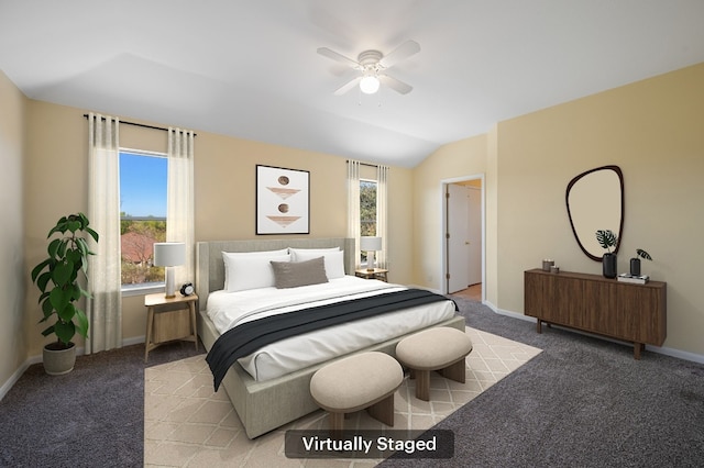 bedroom with light carpet, vaulted ceiling, multiple windows, and ceiling fan