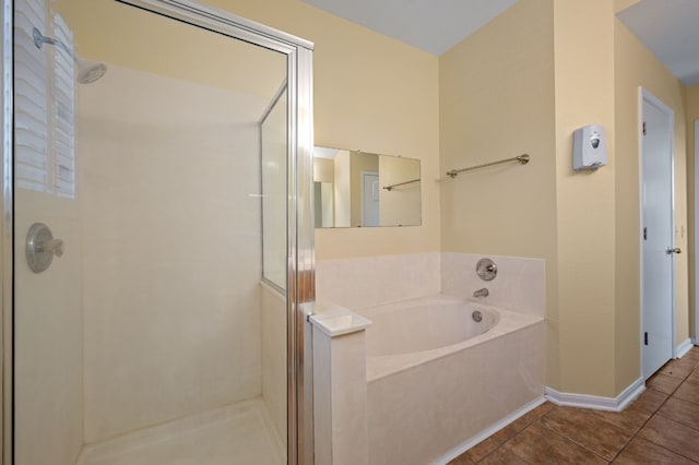 bathroom featuring tile patterned flooring and independent shower and bath