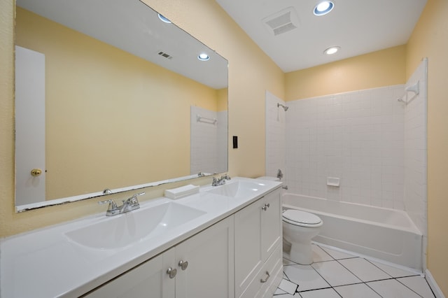 full bathroom featuring tile patterned floors, vanity, toilet, and tiled shower / bath