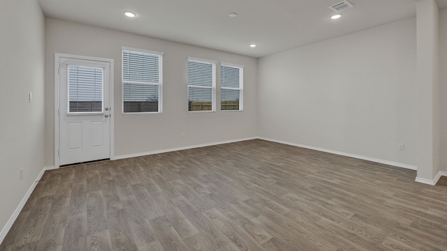 empty room with light hardwood / wood-style floors