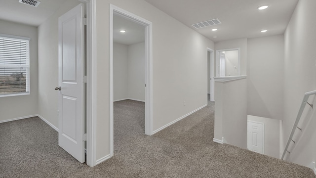 hallway featuring carpet