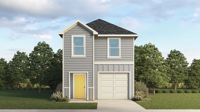 view of front of home with a front lawn and a garage