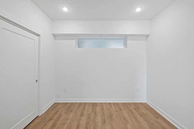 unfurnished room with light hardwood / wood-style flooring