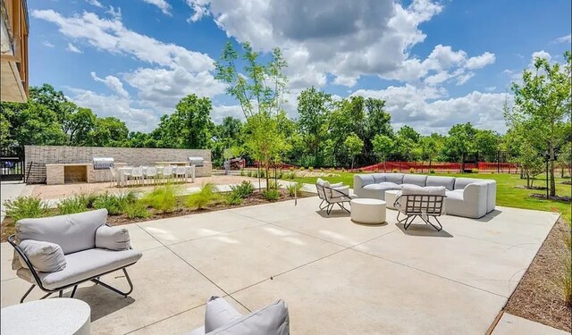 view of patio featuring area for grilling and an outdoor hangout area