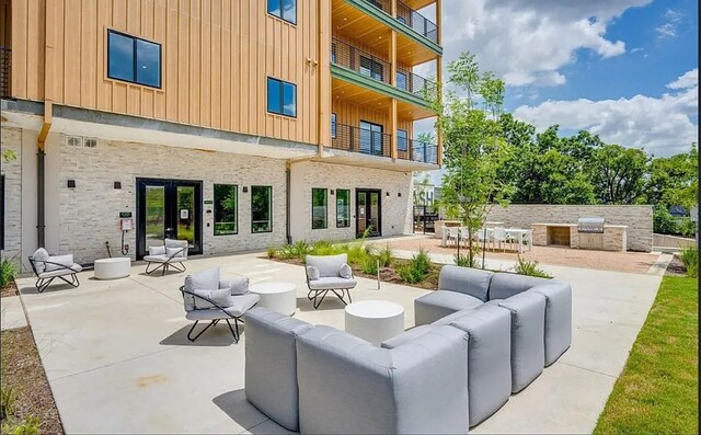 view of patio / terrace with outdoor lounge area, french doors, a balcony, and area for grilling