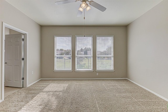 401 Bonham Loop, Georgetown, TX 78633 - empty room featuring a healthy amount of sunlight, baseboards, a ceiling fan, and light colored carpet