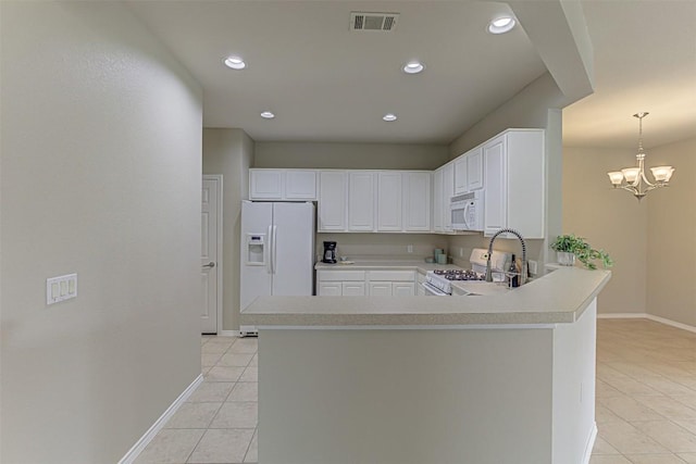 401 Bonham Loop, Georgetown, TX 78633 - kitchen featuring light tile patterned floors, baseboards, white appliances, and visible vents