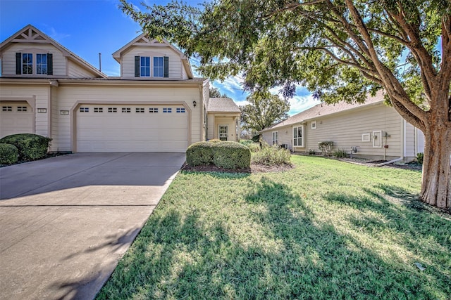 view of front of house featuring a front lawn and a garage