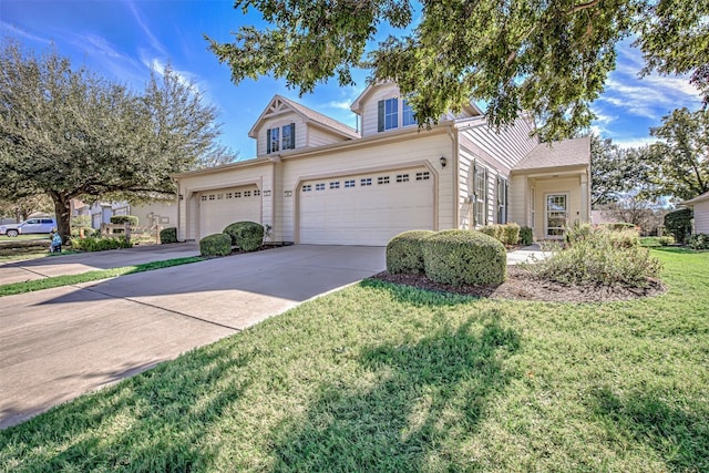 front facade with a garage and a front lawn