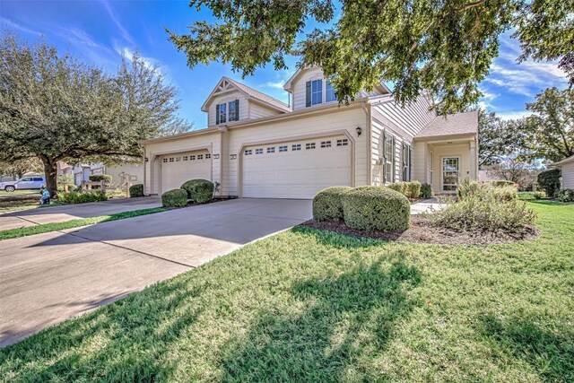 401 Bonham Loop, Georgetown, TX 78633 - view of front of property featuring a garage, a front lawn, and driveway