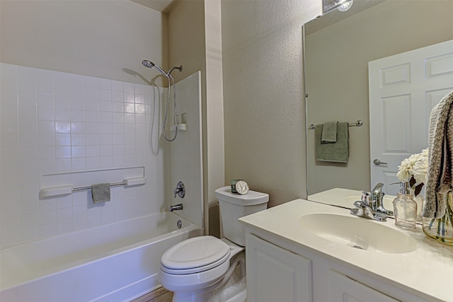 full bathroom with vanity, tiled shower / bath combo, and toilet