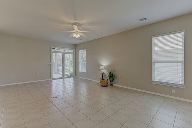 401 Bonham Loop, Georgetown, TX 78633 - unfurnished room featuring baseboards, a ceiling fan, and light tile patterned flooring