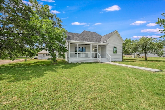 view of front of property featuring covered porch and a front yard