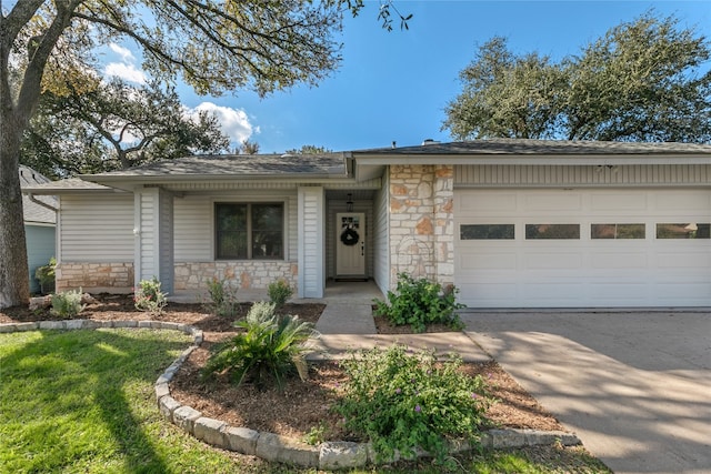 ranch-style home featuring a garage