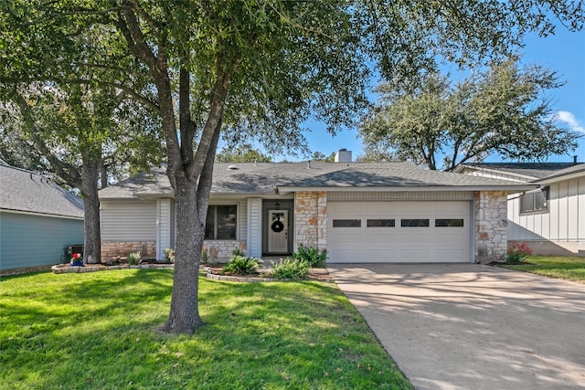 single story home with a garage and a front lawn