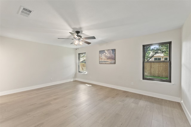 unfurnished room featuring light wood-type flooring and ceiling fan