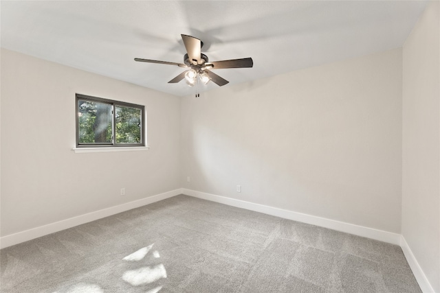 unfurnished room with ceiling fan and carpet floors