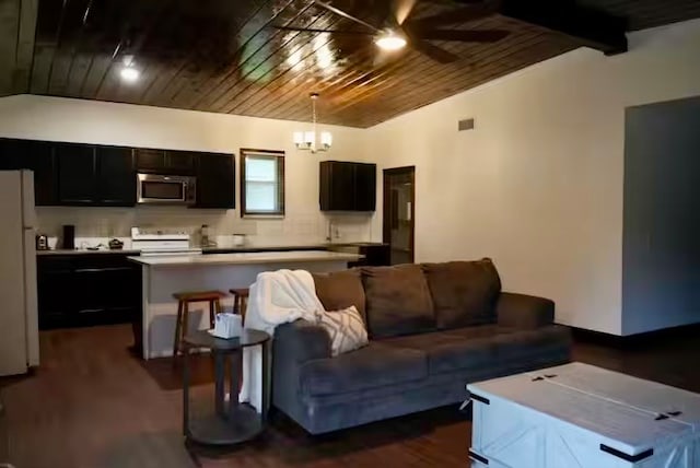 living room featuring dark hardwood / wood-style flooring, lofted ceiling, and wooden ceiling