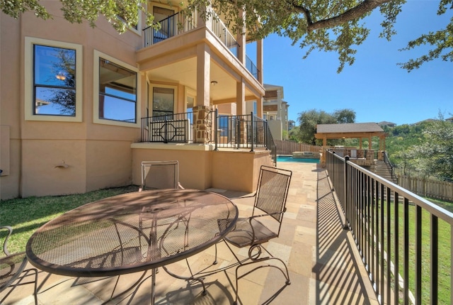 view of patio / terrace with a balcony