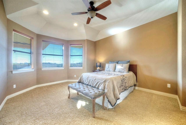 carpeted bedroom featuring ceiling fan, lofted ceiling, and multiple windows