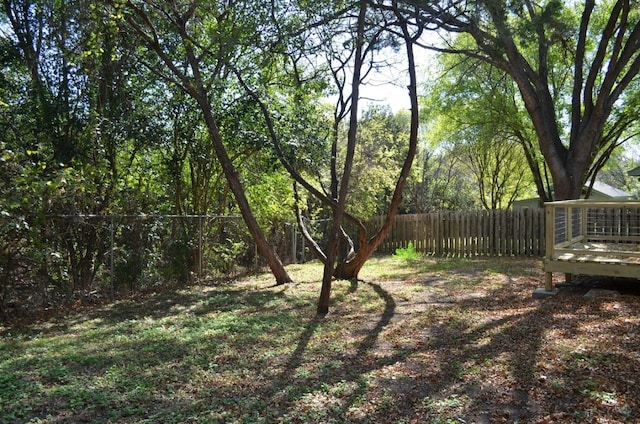 view of yard with a wooden deck