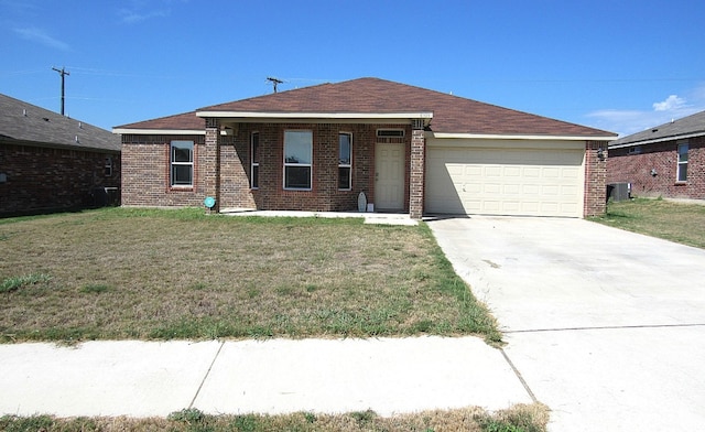 ranch-style home with central AC unit, a garage, and a front lawn