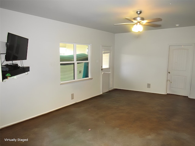 unfurnished living room featuring ceiling fan