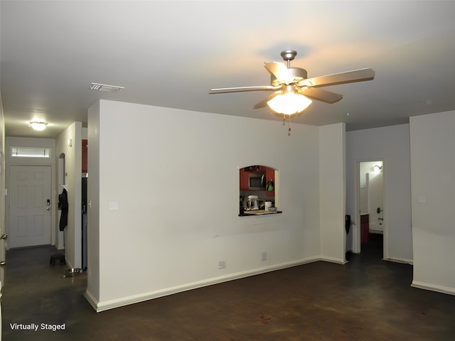 unfurnished room featuring ceiling fan