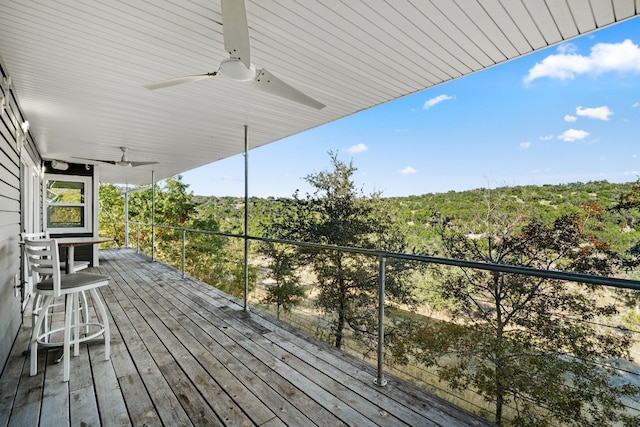 wooden terrace featuring ceiling fan