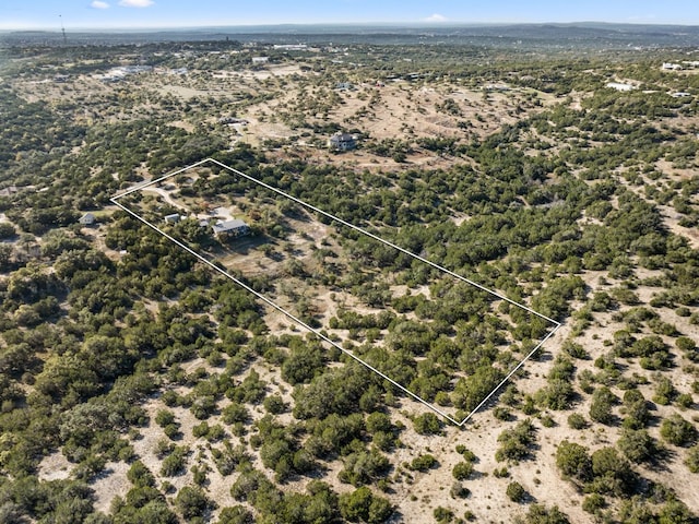 21200 Bertram Ln, Spicewood, TX 78669 - aerial view of sparsely populated area with property boundaries highlighted and a desert landscape