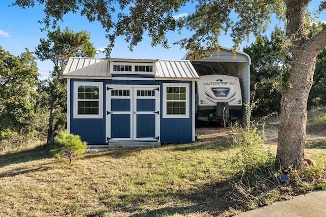 21200 Bertram Ln, Spicewood, TX 78669 - view of shed with a carport